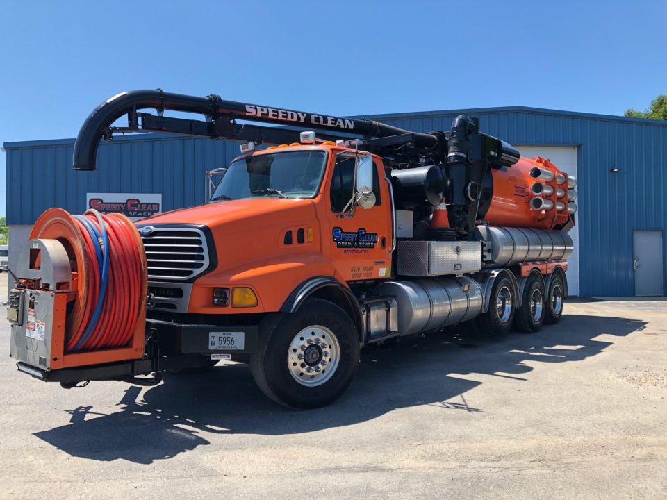 speedy clean truck in warehouse parking lot